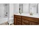 Bathroom with a double sink vanity and white shower and tub combination at 307 Ernest Ave, Peachtree City, GA 30269