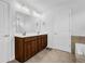 Bright bathroom with double sink vanity, tile floors, and white walls at 307 Ernest Ave, Peachtree City, GA 30269