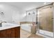 Bright bathroom with tile floors, soaking tub, glass shower, and single vanity at 307 Ernest Ave, Peachtree City, GA 30269