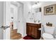 Powder room with vanity, dark wood cabinet, and modern fixtures at 307 Ernest Ave, Peachtree City, GA 30269