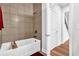 Bathroom featuring a bathtub with tile surround, and a modern shower head at 307 Ernest Ave, Peachtree City, GA 30269