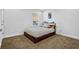 This bedroom features a large window, comfortable bed, and carpeted floors at 307 Ernest Ave, Peachtree City, GA 30269