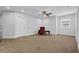 Spacious bonus room features plush carpet, ceiling fan and plenty of natural light at 307 Ernest Ave, Peachtree City, GA 30269