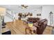 Open-concept living area with hardwood floors, sofas, and natural lighting at 307 Ernest Ave, Peachtree City, GA 30269
