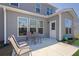 A comfortable outdoor patio with seating, perfect for relaxing and enjoying the backyard at 307 Ernest Ave, Peachtree City, GA 30269