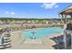Community pool with plenty of lounge seating and umbrellas at 307 Ernest Ave, Peachtree City, GA 30269