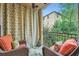 Cozy balcony with two cushioned chairs offering a private outdoor retreat with decorative accents at 3777 Peachtree Ne Rd # 1512, Brookhaven, GA 30319