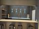Stylish bar area with modern lighting, sleek countertops, dark cabinetry, and comfortable seating at 3777 Peachtree Ne Rd # 1512, Brookhaven, GA 30319
