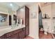 Bathroom featuring tile flooring, a vanity with ample storage, and well-lit mirror at 3777 Peachtree Ne Rd # 1512, Brookhaven, GA 30319