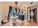 Bright dining area featuring a chandelier, table with clear chairs and hardwood floors at 3777 Peachtree Ne Rd # 1512, Brookhaven, GA 30319