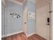 Stylish foyer with wood floors, decorative wall paper and organized bulletin board at 3777 Peachtree Ne Rd # 1512, Brookhaven, GA 30319