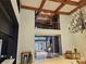 Elegant two-story foyer featuring a grand chandelier, wooden coffered ceilings, and marble floors at 3777 Peachtree Ne Rd # 1512, Brookhaven, GA 30319
