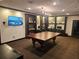 Well-equipped game room featuring a pool table, TV, computer desks, and comfortable seating at 3777 Peachtree Ne Rd # 1512, Brookhaven, GA 30319