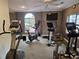 Exercise room featuring cardio equipment, ceiling fans and a TV at 3777 Peachtree Ne Rd # 1512, Brookhaven, GA 30319