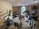 Exercise room featuring cardio equipment, ceiling fans and a TV at 3777 Peachtree Ne Rd # 1512, Brookhaven, GA 30319