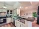 Spacious kitchen featuring granite countertops, stainless steel appliances and bar seating at 3777 Peachtree Ne Rd # 1512, Brookhaven, GA 30319