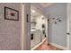 Laundry room with modern washer and dryer, featuring fun wallpaper and mirrored sliding door at 3777 Peachtree Ne Rd # 1512, Brookhaven, GA 30319