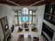 Spacious, two-story living room overlooking the pool area and filled with an abundance of natural light at 3777 Peachtree Ne Rd # 1512, Brookhaven, GA 30319