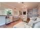 Inviting living room featuring hardwood floors, stylish decor, and an open layout to the kitchen at 3777 Peachtree Ne Rd # 1512, Brookhaven, GA 30319