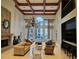 Elegant lobby featuring a fireplace, bar area, and comfortable seating arrangements beneath a grand chandelier at 3777 Peachtree Ne Rd # 1512, Brookhaven, GA 30319