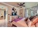 Comfortable main bedroom featuring hardwood floors, ceiling fan, and an adjacent seating area at 3777 Peachtree Ne Rd # 1512, Brookhaven, GA 30319