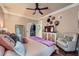 Cozy main bedroom with hardwood floors, ceiling fan, walk-in closet and neutral decor at 3777 Peachtree Ne Rd # 1512, Brookhaven, GA 30319