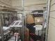 Enclosed storage area with metal lattice featuring boxes and other personal belongings at 3777 Peachtree Ne Rd # 1512, Brookhaven, GA 30319