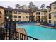 Community swimming pool with blue lounge chairs in the sun at 3777 Peachtree Ne Rd # 1512, Brookhaven, GA 30319