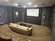 Enjoy movie nights in this theater room with tiered seating and a projector screen at 3777 Peachtree Ne Rd # 1512, Brookhaven, GA 30319