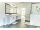 Bright bathroom featuring double vanity, large mirror, and a walk-in shower with white subway tile at 3790 Andover St, Cumming, GA 30028