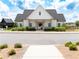 Community clubhouse featuring white siding, dark roof, and well manicured shrubs at 3790 Andover St, Cumming, GA 30028