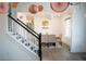 Elegant dining room adjacent to staircase with modern chandelier and decor at 3790 Andover St, Cumming, GA 30028