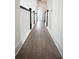 Upstairs hallway features hardwood floors and clean white trim at 3790 Andover St, Cumming, GA 30028