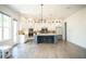 Spacious kitchen featuring a large center island, stainless steel appliances, and ample cabinet space at 3790 Andover St, Cumming, GA 30028