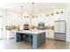 Spacious kitchen featuring a large center island, stainless steel appliances, and ample cabinet space at 3790 Andover St, Cumming, GA 30028