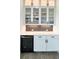 Kitchenette features granite counters, wine cooler, and tile backsplash at 3790 Andover St, Cumming, GA 30028