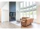 Bright living room boasts a fireplace, large windows, and hardwood floors at 3790 Andover St, Cumming, GA 30028