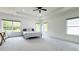 Spacious main bedroom features a tray ceiling, neutral carpet, large windows, and recessed lighting at 3790 Andover St, Cumming, GA 30028