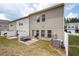 Backyard view featuring patio, picnic table, grill, and privacy fence at 406 Crescent Woode Dr, Dallas, GA 30157