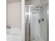 Close up of the bathroom with tub and shower behind glass door at 406 Crescent Woode Dr, Dallas, GA 30157