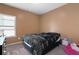 Bedroom with neutral walls, window, carpet, and decorative elements at 406 Crescent Woode Dr, Dallas, GA 30157