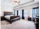 Spacious bedroom with tray ceilings, plush carpeting, and large windows at 406 Crescent Woode Dr, Dallas, GA 30157
