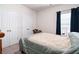 Cozy bedroom featuring neutral walls, closet, and a window with natural light at 406 Crescent Woode Dr, Dallas, GA 30157