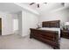 Large primary bedroom showcasing neutral colors, tray ceiling and lots of natural light at 406 Crescent Woode Dr, Dallas, GA 30157