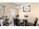 Cozy dining area with a glass table and a view of the backyard at 406 Crescent Woode Dr, Dallas, GA 30157