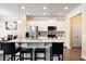 Modern kitchen featuring a large island with bar seating and stainless steel appliances at 406 Crescent Woode Dr, Dallas, GA 30157