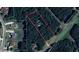 Aerial view of the property surrounded by lush trees at 5755 Hendrix Rd, Cumming, GA 30040