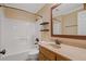 Bathroom with tub/shower combo, single vanity and built-in shelves at 5755 Hendrix Rd, Cumming, GA 30040