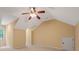 Neutral bedroom featuring vaulted ceilings, ceiling fan, and comfortable carpeting at 5755 Hendrix Rd, Cumming, GA 30040