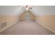 Spacious bonus room showcasing neutral walls, plush carpeting, and a ceiling fan, offering versatile living space at 5755 Hendrix Rd, Cumming, GA 30040